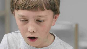 a boy is using a medicine drop video