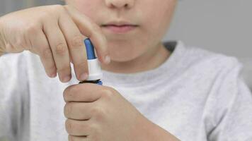 a boy is using a medicine drop video