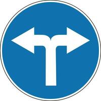 Sign turn left and right. Mandatory sign. Round blue sign. Turn right and left. Sign allows movement only to the right and to left. Obey the rules of the road. Road sign. vector