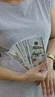 Business and financial concept, money in hand, dollar bill in hand, female hand holding money dollar video