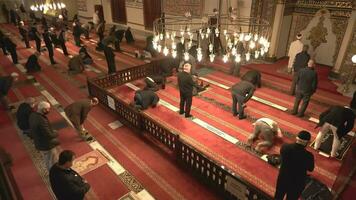 Bursa, Turkey, 2023 - Crowd of Muslim people praying in Bursa Grand Ulu Mosque. video