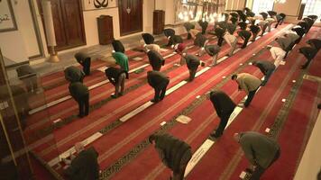 Bursa, Turkey, 2023 - Crowd of Muslim people praying in Bursa Grand Ulu Mosque. video