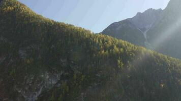 the sun shines through the clouds above a mountain video