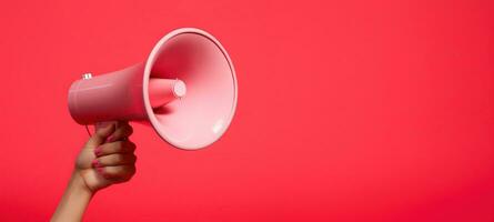 Generative AI, megaphone in hand on a empty pink background, panoramic image with copy space photo