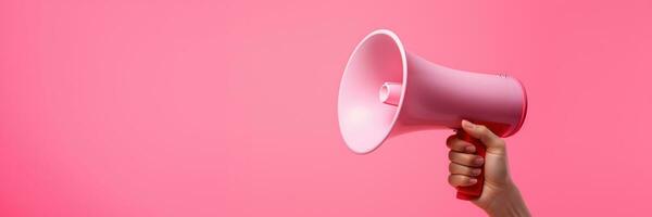 Generative AI, megaphone in hand on a empty pink background, panoramic image with copy space photo