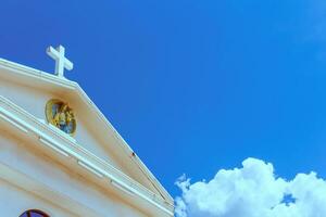 white cross on blue sky photo