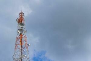 Telecommunication tower in blue sky photo