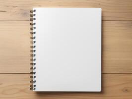 Top view of spiral notebok with pencil on wooden table. Emtry page for text. . photo
