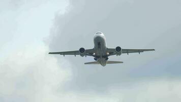 Front view, the plane flying overhead. Aircraft success took off, removed the landing gear and is gaining altitude video