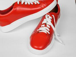 Red leather sneakers with white soles. new photo