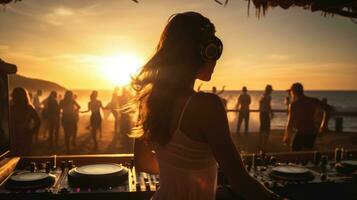 Beautiful female dj at beach party during sunset. Carefree life photo