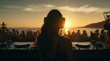 Beautiful female dj at beach party during sunset. Carefree life photo