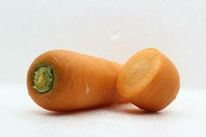 Fresh vegetable carrots on white background cut into slices. photo