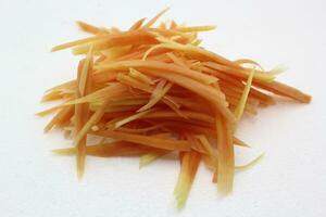 Fresh shredded papaya for salad on white background photo