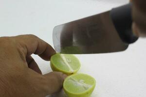 Cut the lemon into 2 halves on white Background. photo