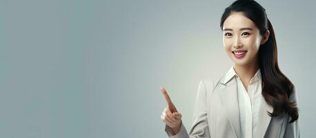 Cheerful Asian woman with copy space for presentation and promotion photo