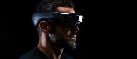 A man in his thirties wearing virtual reality glasses on a dark background with a focus on artificial intelligence hacking fraud Copy space available photo