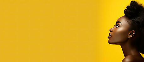 A young black woman glancing at a copy space on a yellow background captivated by captivating information or an appealing offer with room for text or a photo