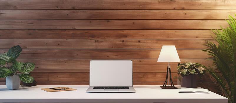 Top view of a busy businessman working at a wooden desk using a laptop talking on the phone and taking notes with a panoramic view including empty spac photo