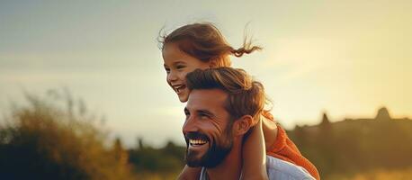 Girl sitting on dad s shoulders laughing Summer family lifestyle concept Space for text photo