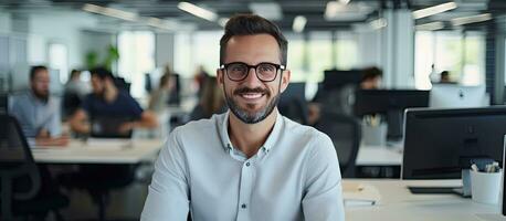 Smiling male software developer at work in office ample space photo