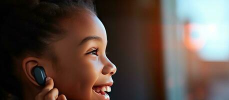 Black teen girl with hearing aid presses button on smartphone at home close up photo