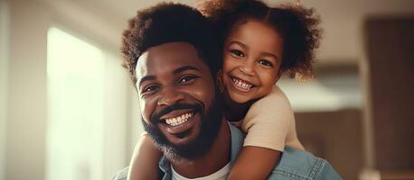 Happy African American father and daughter playing father carrying little girl Joyful family bonding Father s Day concept banner with copy space photo