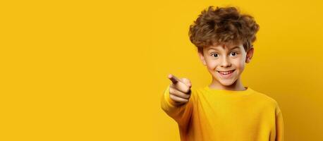 Teen shows empty space for promo idea poses on yellow background photo