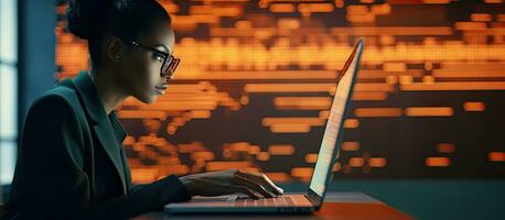 Female IT developer typing on keyboard with programming code and laptop in office interior copy space available photo