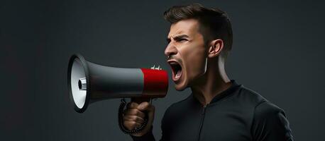 Handsome young man wins the day with a megaphone photo