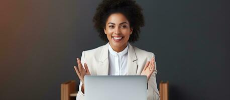 Young African American businesswoman in formal attire confidently communicates during office interview with space for text photo