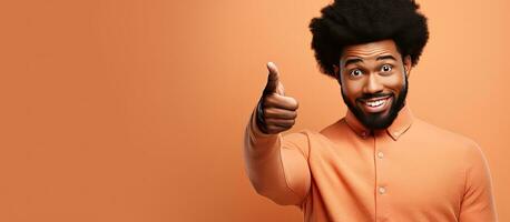 Excited black man pointing surprised woman looking at open space for ad banner photo