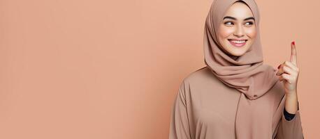 Confident young Arab woman in hijab pointing in different directions for an advertisement photo