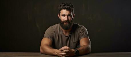 Bearded man with empty space on a table photo