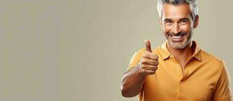 Content middle aged man happily points to empty area while smiling confidently photo