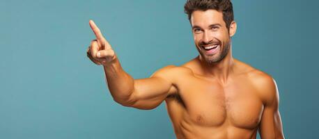 Shirtless Caucasian man confidently points in different directions smiling promoting an advertisement photo