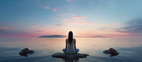 Rear view of woman by the sea embodying meditation and healthy lifestyle photo