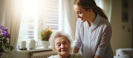 Caregiver embraces elderly woman during visit at home photo