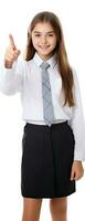 Happy girl in uniform pointing and looking at camera isolated on white background photo