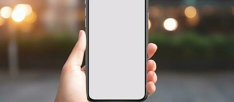 Close up image of female hands holding mobile device with blank screen representing technology concept photo