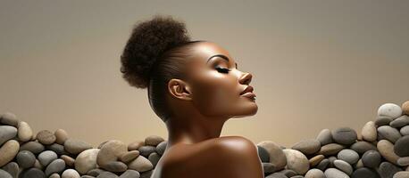 Composite image of a woman with pebbles on her back promoting National Spa Week for public awareness of the benefits of relaxation and wellbeing photo