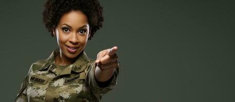 Confident African American woman in camouflage army uniform smiling and pointing in different directions photo