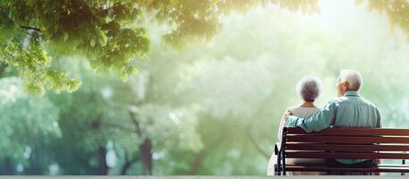 Asian and Caucasian couple nurse helping elderly man outdoors holding hands room for text web banner photo