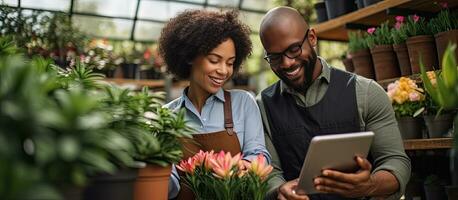 Multicultural plant nursery workers using tablet and drinking coffee photo