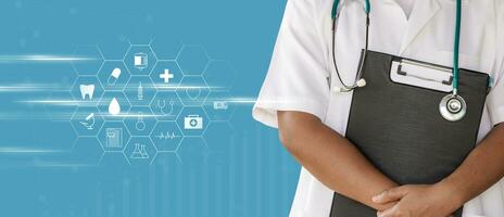 Concept of health and medicine, Doctor with lab coat on cyan background holding a clipboard. photo