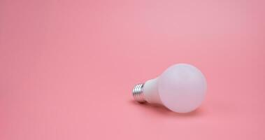 A light bulb in the pink background , New idea concept photo
