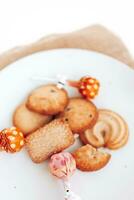 Butter cookies in a white plate on a white background. photo