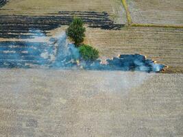 Aerial shot from a drone Burning of agricultural products, concepts of environmental conservation and global warming. photo