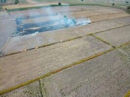 Aerial shot from a drone Burning of agricultural products, concepts of environmental conservation and global warming. photo