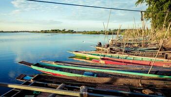 Many fishermen boats wait to fish in the evening. photo